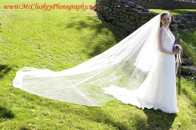 Bride with veil and train behind her