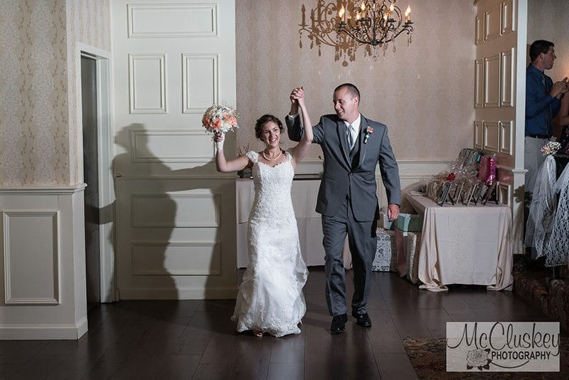 Bride and groom entering wedding hall