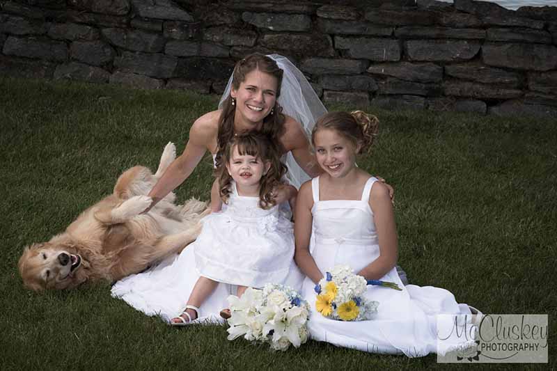 Bride, flower girls, and dog