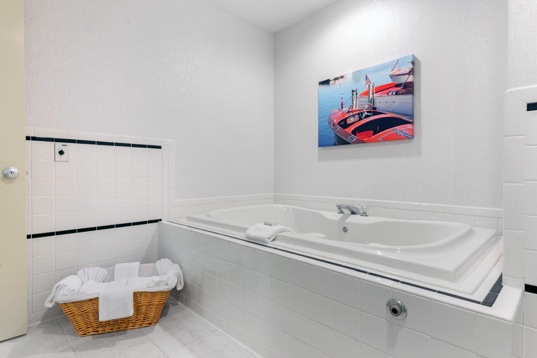 Tub with boat painting.