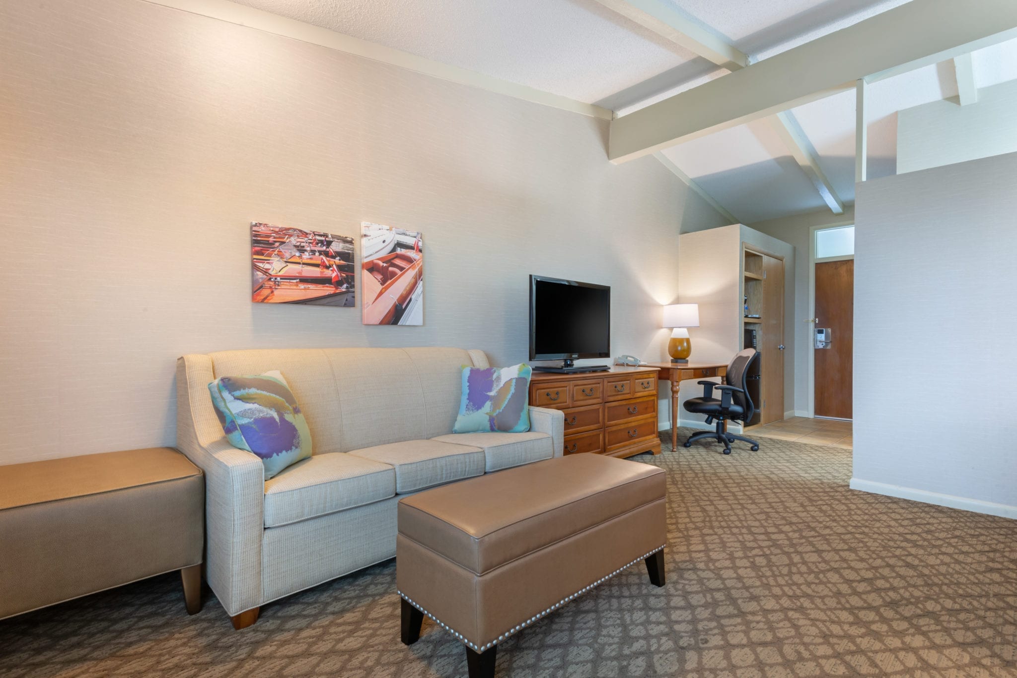 Sitting area with loveseat and TV.