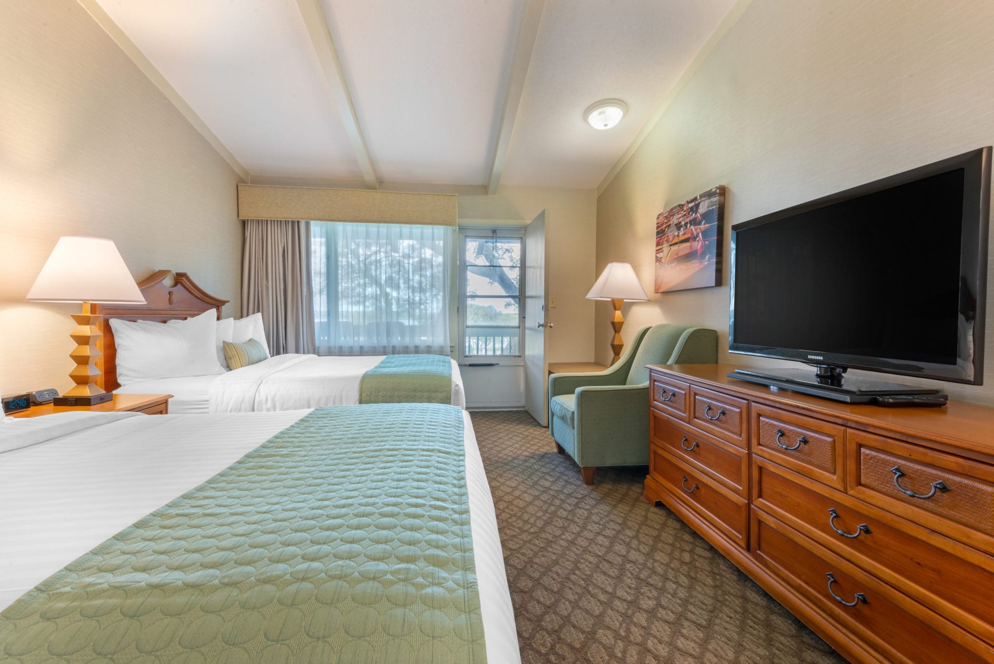 Bedroom with two queen beds viewed from door.