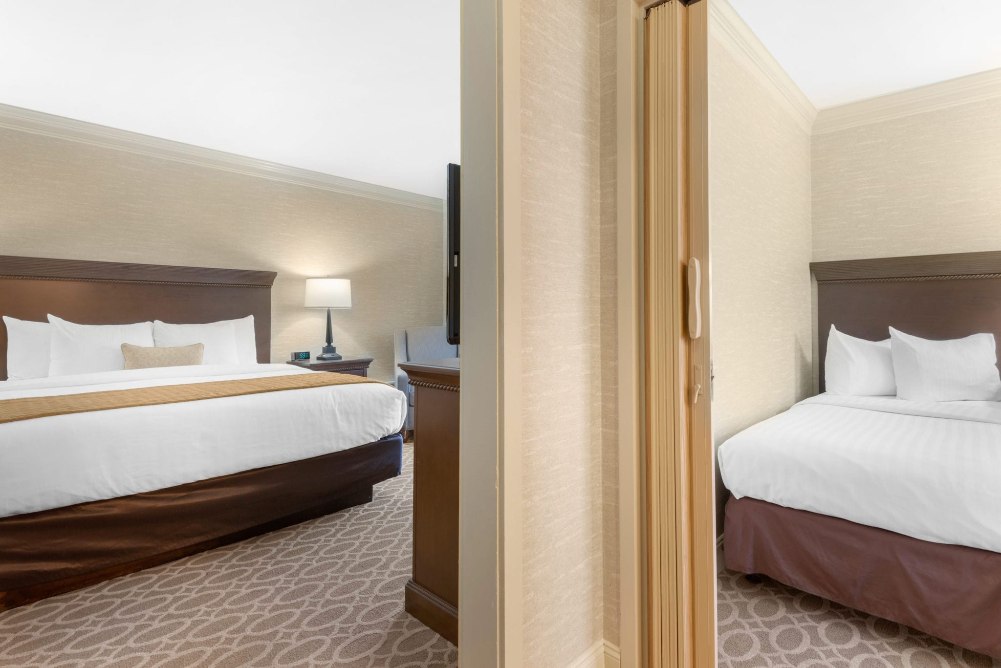 Two bedrooms viewed from hall.
